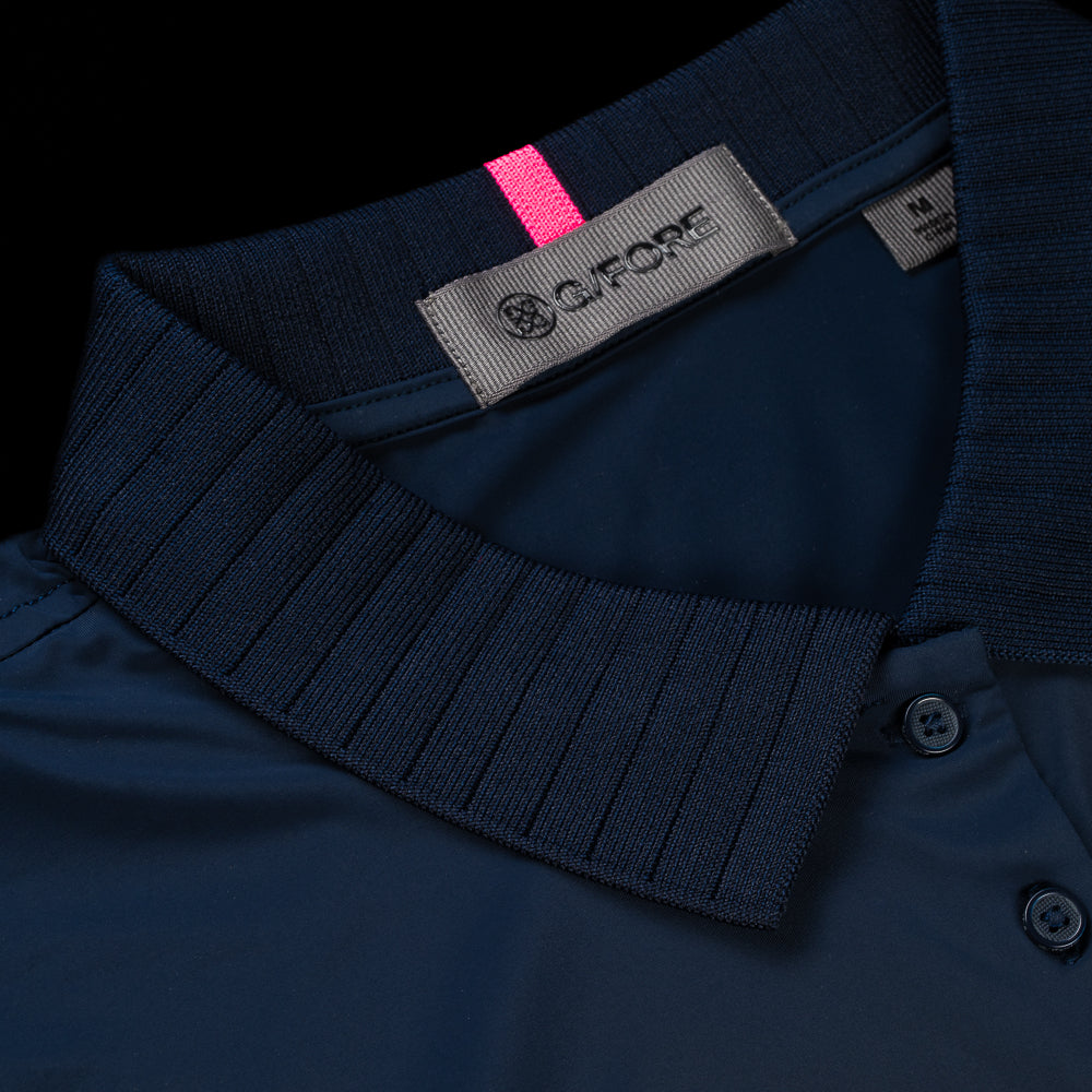 SWAG Golf x G/Fore women's navy pleated collar sleeveless nylon performance golf polo.