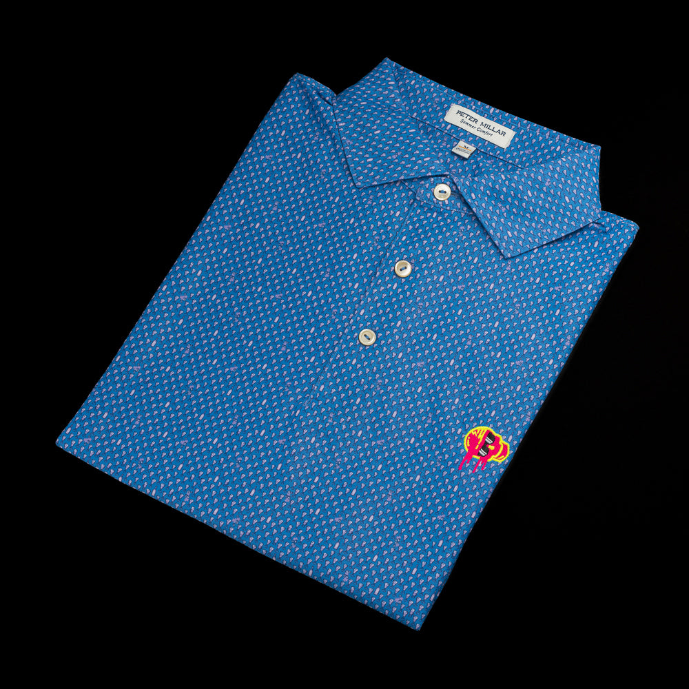SWAG Golf x Peter Millar blue short sleeve performance golf polo shirt with embroidered sideways melting skull over the left chest.