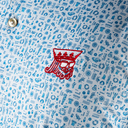 Peter Millar x SWAG light blue golf polo with mini icon print and embroidered red SWAG King logo on chest. 