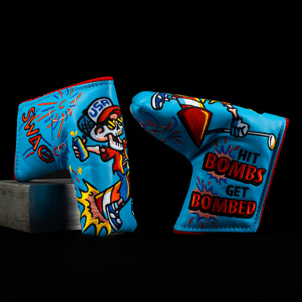 Patriotic Skelly blade putter headcover showing Skelly riding a rocket with “Hit Bombs, Get Bombed” fireworks design.