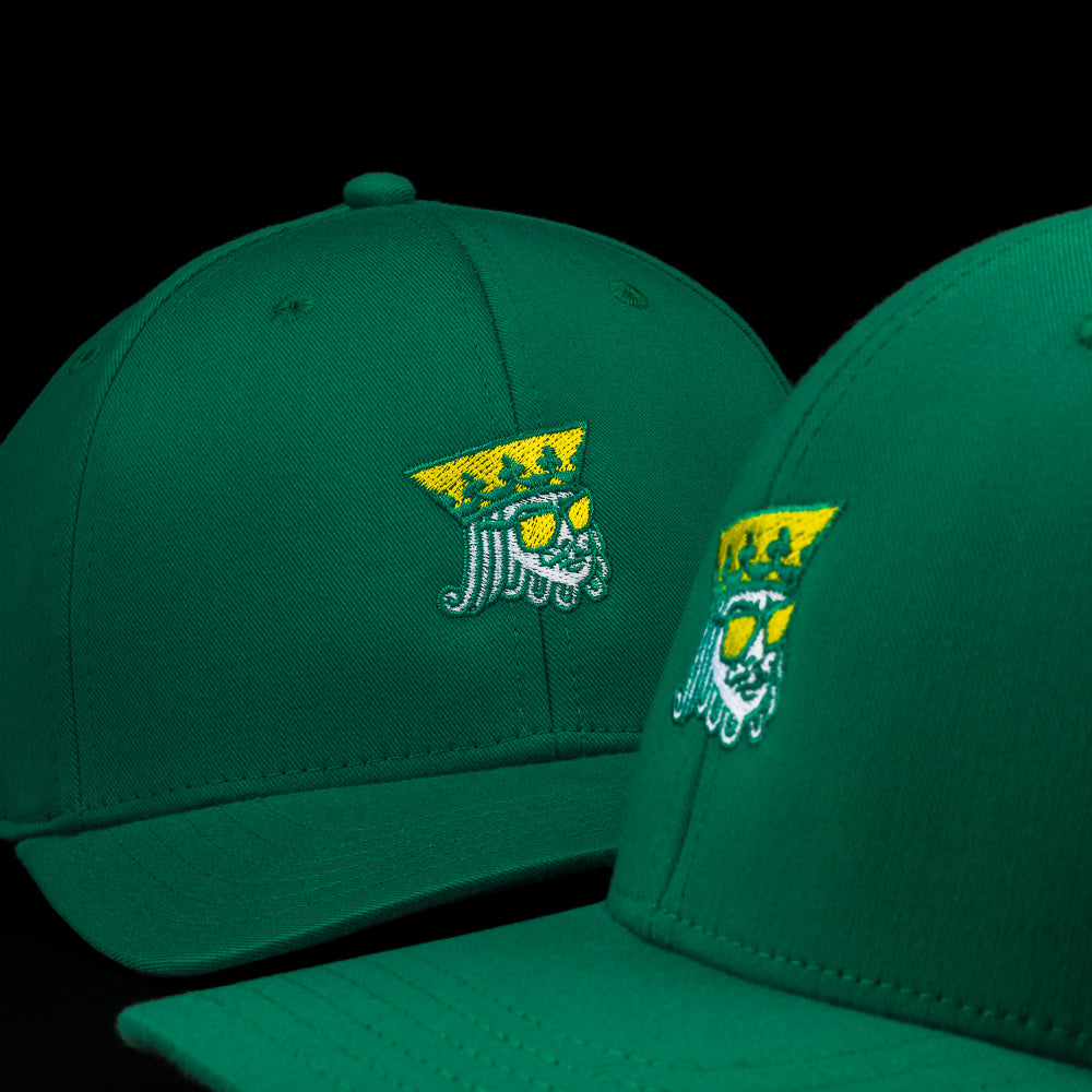 SWAG Golf green golf hat with embroidered King detail on the front and snapback closure.
