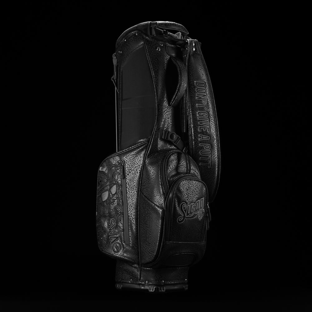 SWAG Golf all black golf stand bag with greatest hits designs on the side panels.