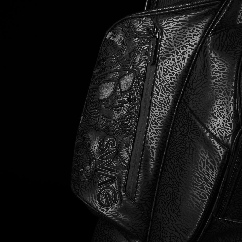 SWAG Golf all black golf stand bag with greatest hits designs on the side panels.