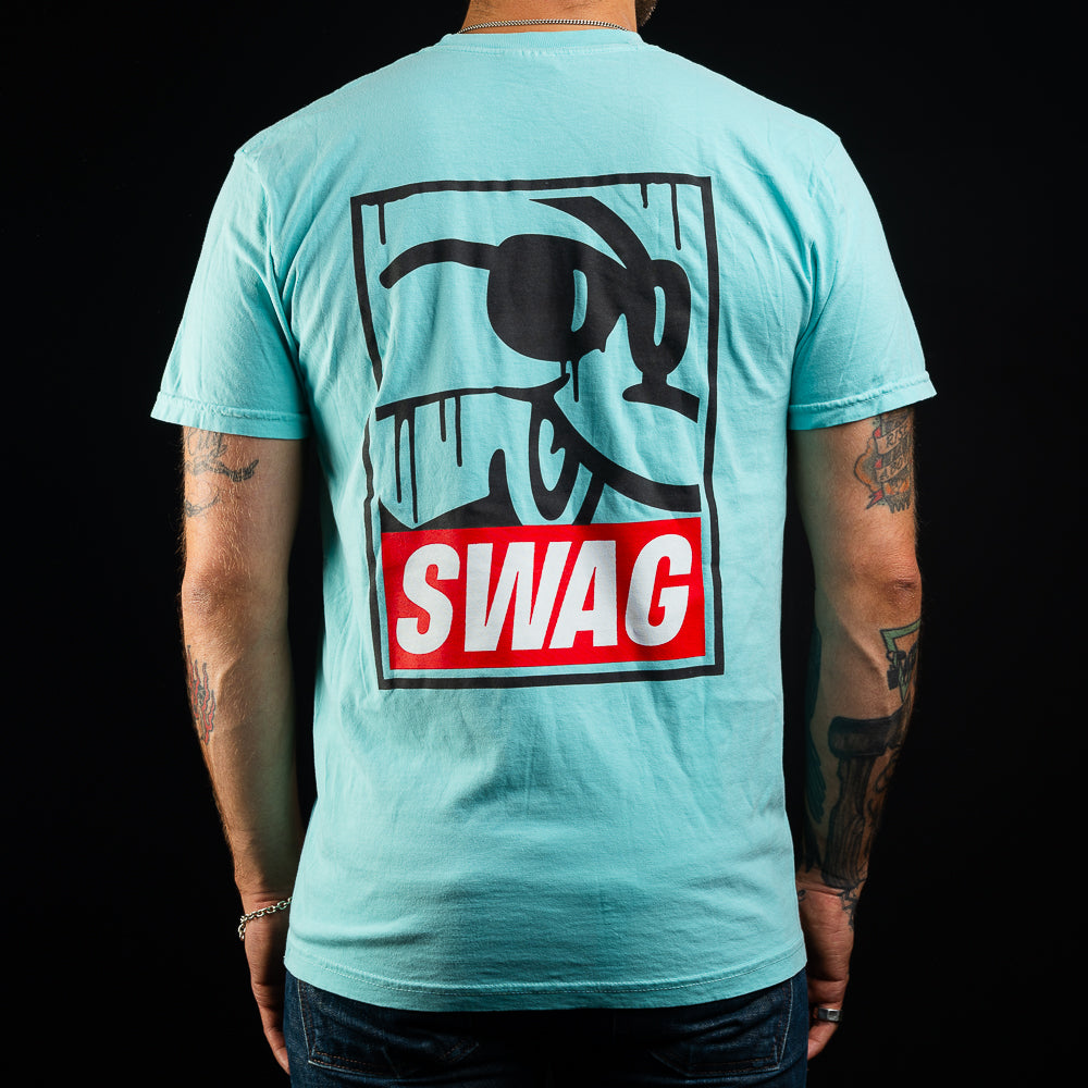 SWAG Golf teal men's short sleeve graphic t-shirt with flipper print and SWAG logo.